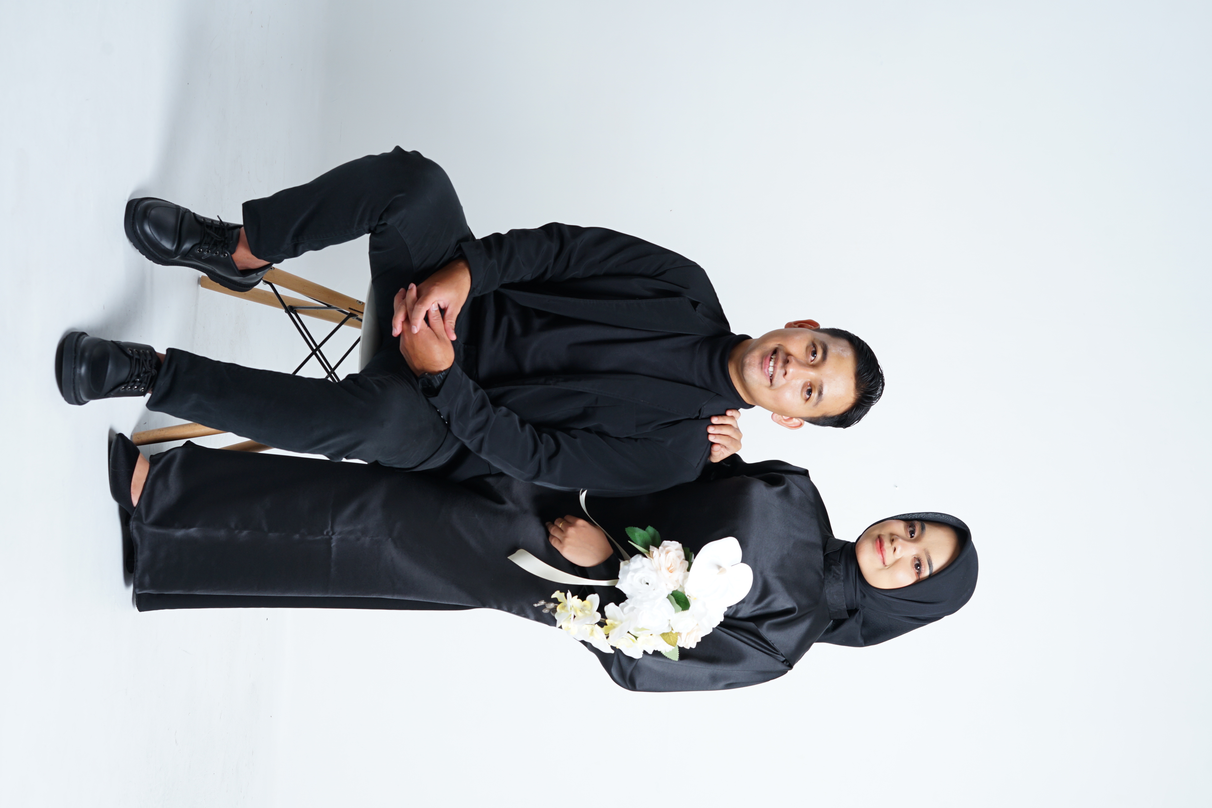 Couple laughing together while hiking in the mountains